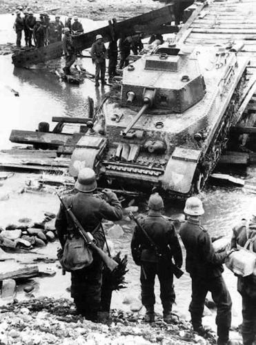 Hungarian Turan I Tank Crossing

On what appears to be a partially destroyed bridge, a Hungarian Turan I medium tank is making a successful crossing while soldiers assist or look on, this all taking place in eastern Poland during 1943-1944. 