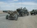 M1114_towing_M102_Howitzer