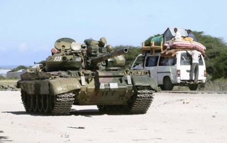 an-african-union-mission-in-somalia-amisom-tank-patrols-the-main-street-after-fighting-between-islamist-and-government-soldiers-in-eelasha-biyaha