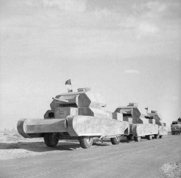 Dummy_tanks,_mounted_on_trucks,_going_to_the_forward_areas_in_the_Western_Desert,_13_February_1942._E8361