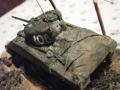 M4 Sherman  (szovjet)   (1/72)

Helló Nagy Dávidnak hívnak, új vagyok a Makettinfon de viszont makettezésben már annyira nem kb. 3 éve csinálom.

A kit

Egy 1/72-es Heller Shermant "felújítottam" és készítettem neki egy szép kis diorámát.A kit nagyon olcsó volt már pontosan nem emlékszem mennyibe került, de arra biztosan, hogy nem drága.
Ez a harckocsi csak egy a Vörös Hadsereg kötelékében szolgáló többi Sherman tank közül.Amit az Egyesült Államok adott a Szovjetuniónak.Első lépésként a tankot lefestettem egy kevert színnel, Revell SM 384 és Humbrol Satin 85 nevezetű színeket "hoztam össze".ezt felvittem rá majd nem sokára egy higított feketével vontam át, de csak annyira amennyire kell.Aztán készítettem hátra egy kis rakományt ez szivacs szépen vágva, formára és arra teljesen átáztatott méretre vágott 2 rétegű zsebkendő került rá.A rakomány rögzítése 2 kicsit erősebb cérna lefestve.Utána feltettem ráa a matricákat és hagytam szépen száradni a járművet.

A dioráma

Alapként egy egyszerű szépen vágott kerek fa alapzatra vittem fel a gipszet.készítettem egy kis utat és egy magasabb dombot.Mikor ezzel megvoltam utána Technokollal ráragasztottam a kiválogatott mohákat és ezt csináltam míg be nem borítottam a felületet vele.Utána megint Technokollal "rögzítettem" a szitált port, a egy kicsit igényesebb játékból való, de valahogy úgy gondoltam jól fog mutatni, és igazam lett (remélem Kedves Olvasó is így van vele :-).A kerítés gyufa szálból van barnával lefestve úgyanúgy mint a villanypózna ami viszont fogpiszkáló.A vezeték fekete cérna méretre vágva.
Azt hiszem ennyi elég is erről a kis diorámáról :-).Jah és van tom 1-2 rafasztó "vonal" az azóta el tűnt.
Üdv.:
SdKfz