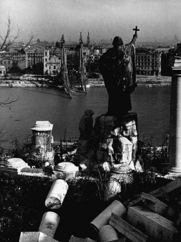 The Siege of Budapest

Bishop Saint Gerard Sagredo’s (Szent Gellért püspök) damaged statue in Buda / Gellért Hill. On the opposite bank of the river Danube lies Pest, where you can see the stump of the Franz Joseph I bridge (today it is called Liberty Bridge) which was blown up in january the 16th 1945. 

