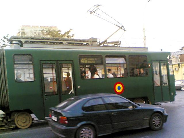 On the streets of Bucharest, a tram  with army symbols.