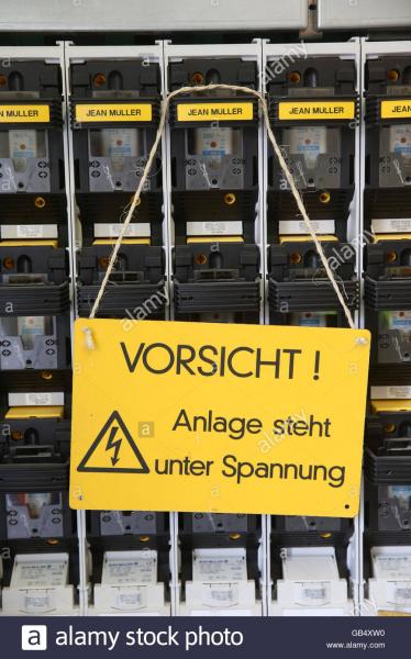 warning-sign-caution-system-is-under-voltage-electrical-switchboard-GB4XW0