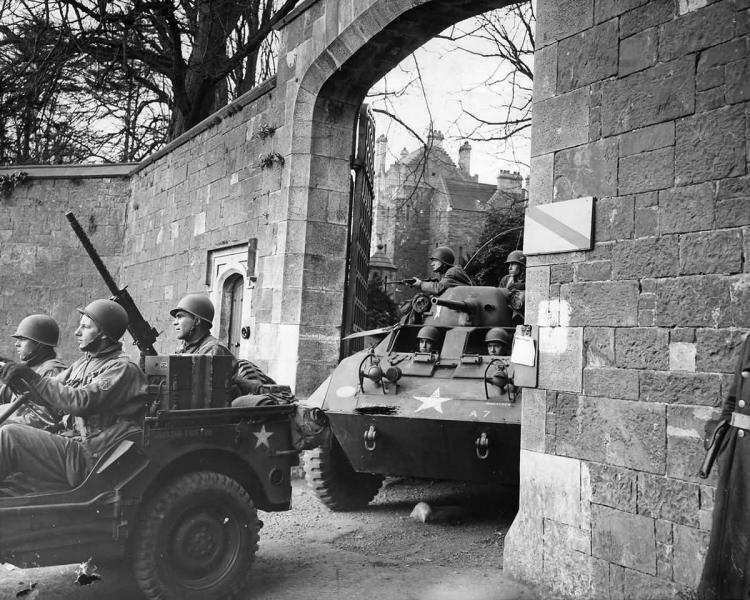 MB_GPW_Jeep_And_M8_Armored_Car_Leave_Castle_For_Invasion_Training_1944