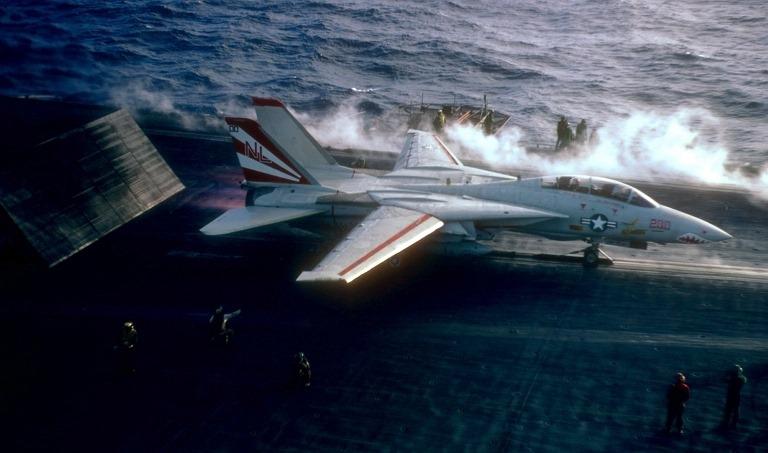 VF-111 F-14A spooling up to full thrust prior to launch from a waist catapult. This aircraft is in full colour livery.